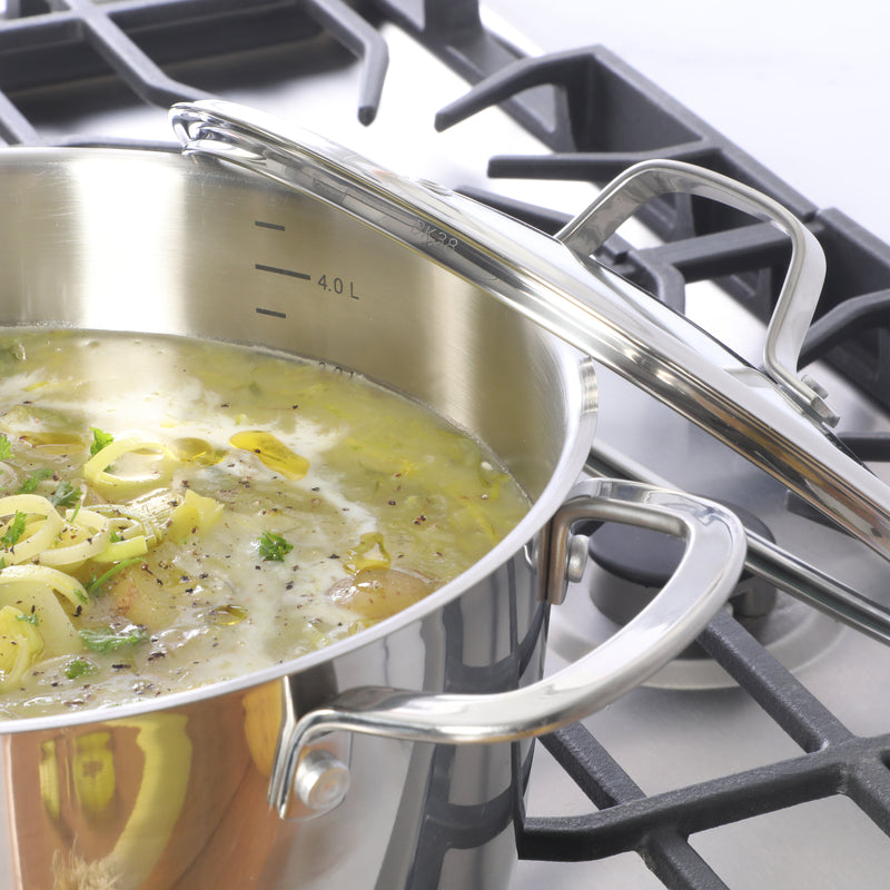 Sur La Table Kitchen Essential Chef's Deck 5.3 qt Stainless Steel Dutch Oven w/ Steamer & Glass Lid - Polish Exterior - Impact Bonded Base - Induction - Stainless Steel Hollow Handle - Color Sleeve w/ Remailer