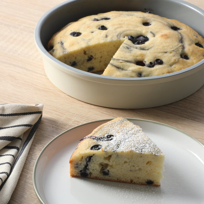 Sur la Table Kitchen Essentials Bake Sale 9" Carbon Steel Cake Pan - Eggshell - Grey Nonstick Interior - Color Label - Round