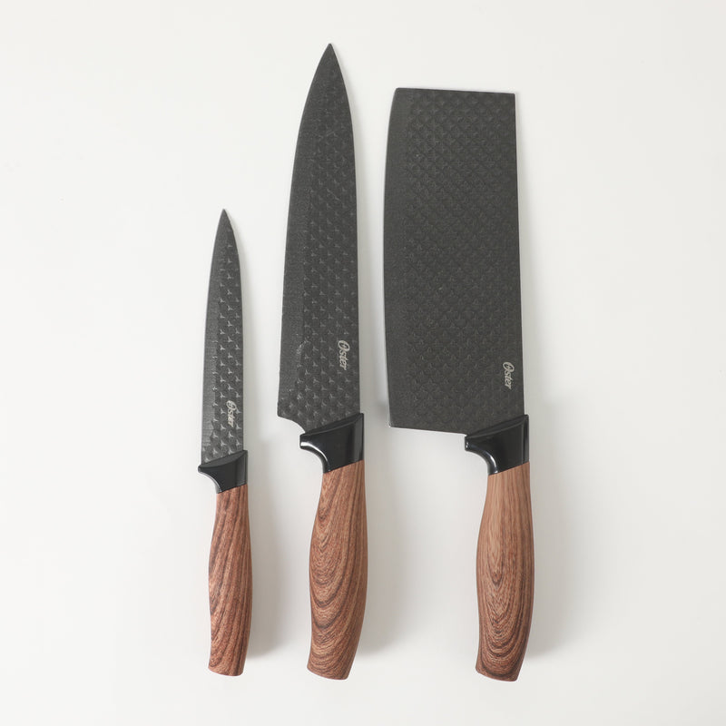 Oster Gunderson 6pc Stainless Steel Cutlery Set w/ Black Cutting Board - Black Textured Nonstick Blade - ABS Bolster/PP Wood Look Handle - Clam Pack