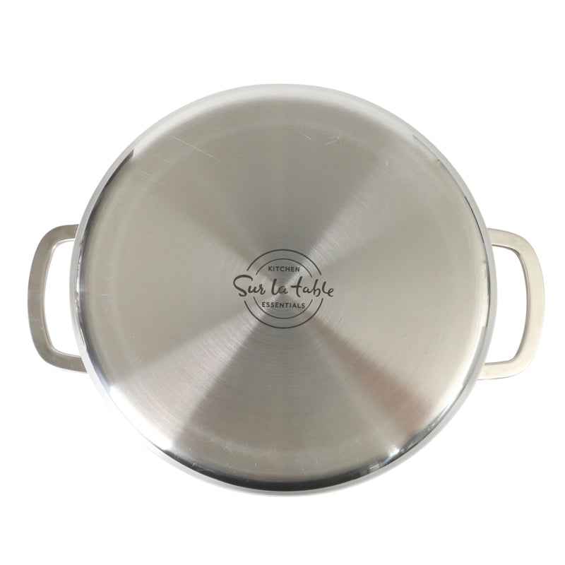 Sur La Table Kitchen Essential Chef's Deck 5.3 qt Stainless Steel Dutch Oven w/ Steamer & Glass Lid - Polish Exterior - Impact Bonded Base - Induction - Stainless Steel Hollow Handle - Color Sleeve w/ Remailer