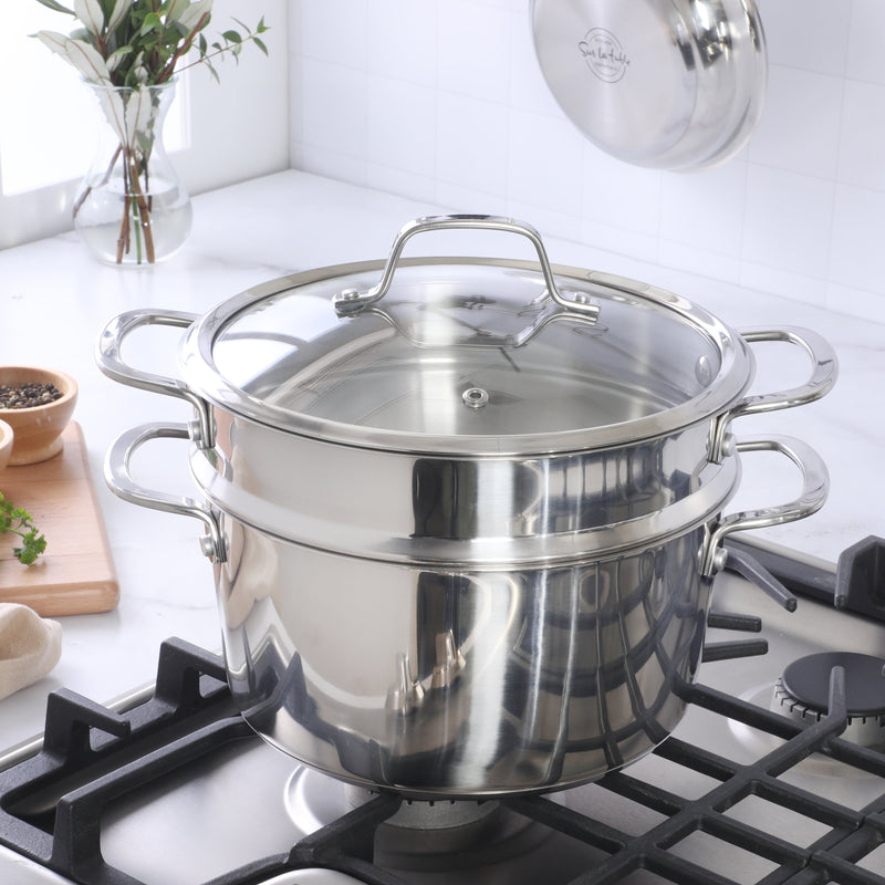 Sur La Table Kitchen Essential Chef's Deck 5.3 qt Stainless Steel Dutch Oven w/ Steamer & Glass Lid - Polish Exterior - Impact Bonded Base - Induction - Stainless Steel Hollow Handle - Color Sleeve w/ Remailer